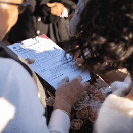 Signing marriage registration paperwork at a Blue Mountains Elopement